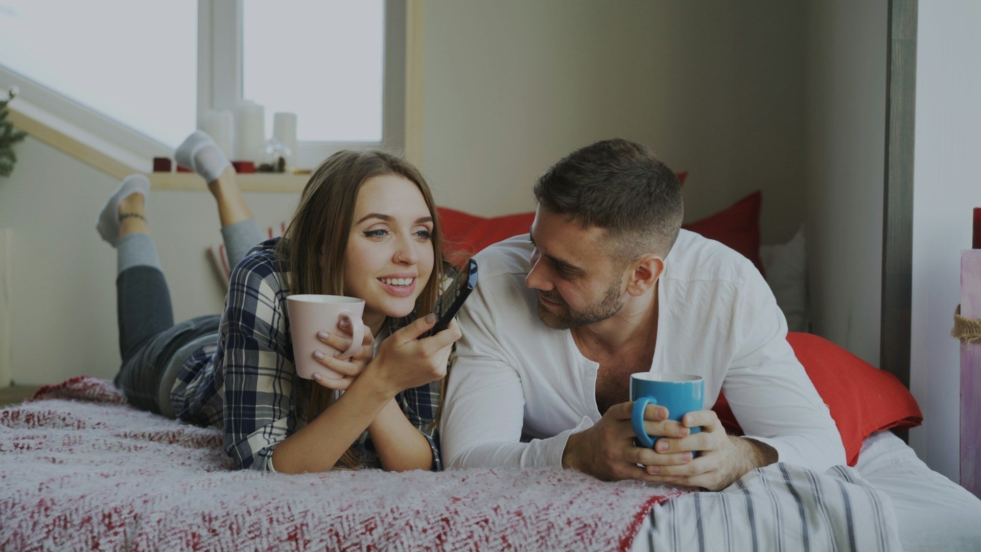 couple talking on bed about intimacy