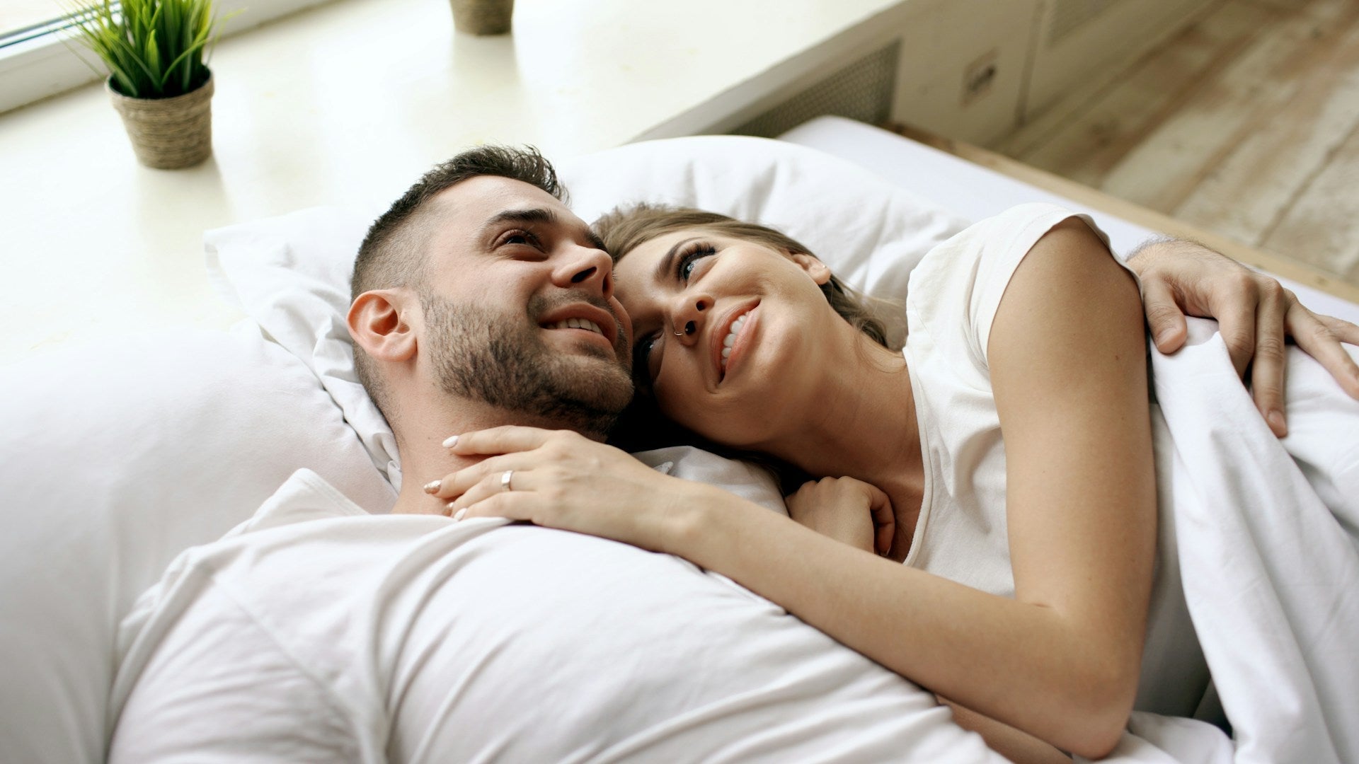 couple in bed sharing intimae moment, 